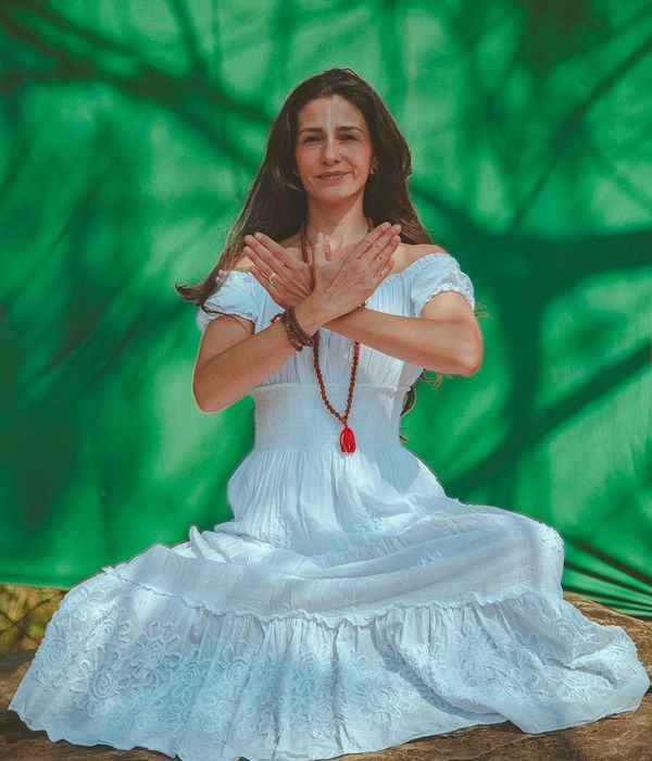 Person performing a graceful yoga balance pose in a calm environment.